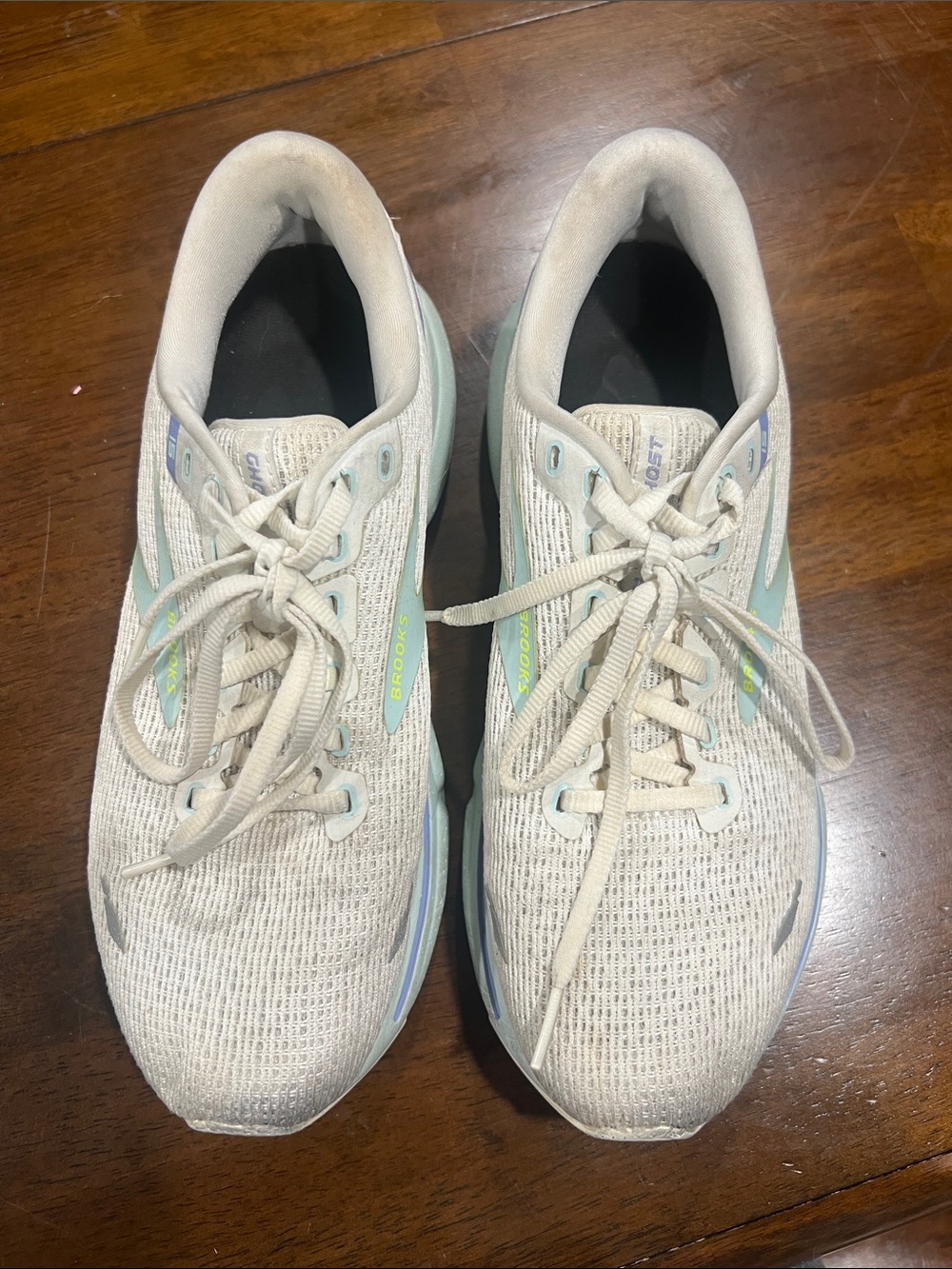 Brooks running shoes in light gray with mint accents